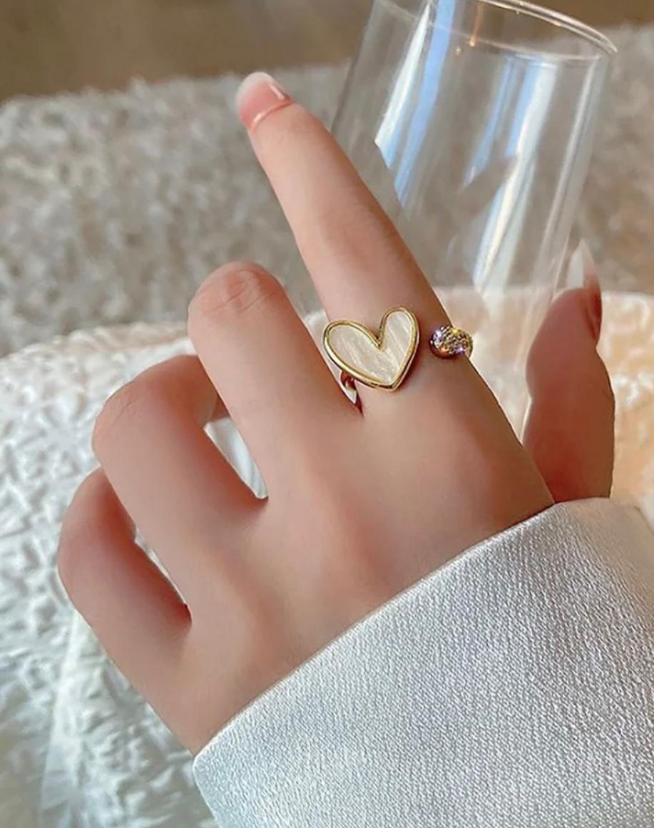 White heart-themed golden ring